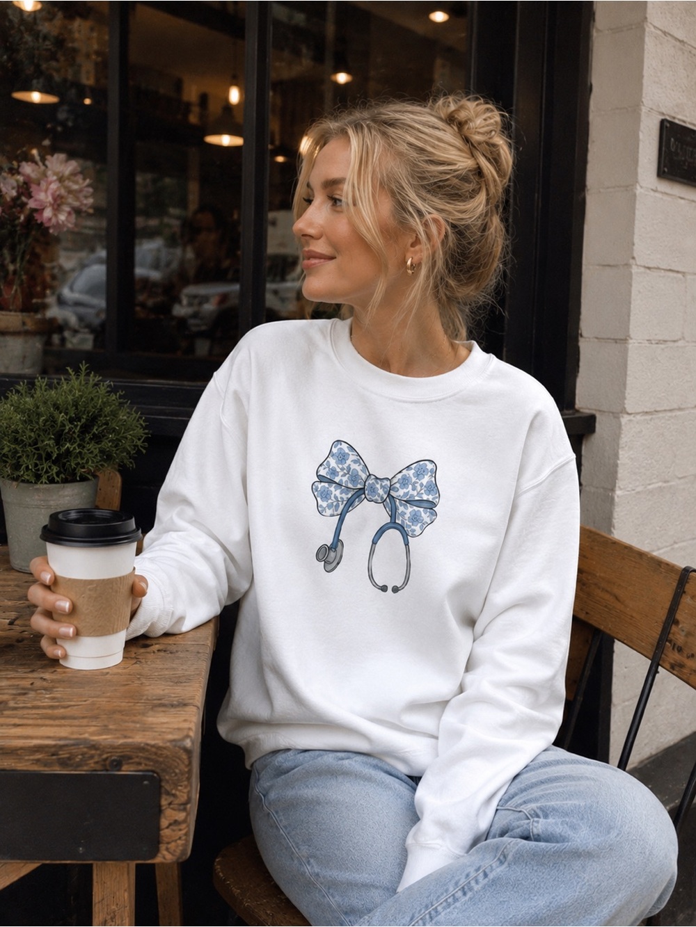 White Crewneck Sweatshirt with Blue Floral Bow Stethoscope Graphic | gifts nurse